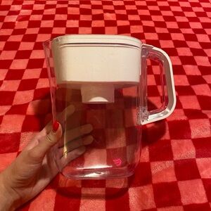 Clear and white Brita water filter pitcher